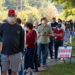 Court Nixes 10-1 Virginia Map Grab Christian Jones and others waiting in a long line outside a polling place