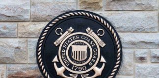 THE CATCH — The Judge Was Their Own APPOINTEE Bronze emblem of the United States Coast Guard mounted on a stone wall