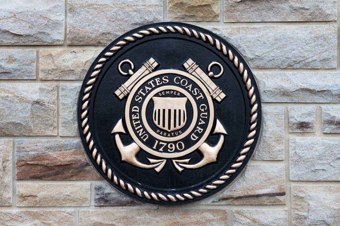 shutterstock_195060344 Bronze emblem of the United States Coast Guard mounted on a stone wall
