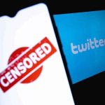 smartphone showing censored stamp beside twitter logo