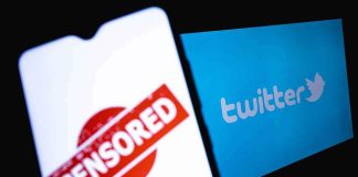 smartphone showing censored stamp beside twitter logo