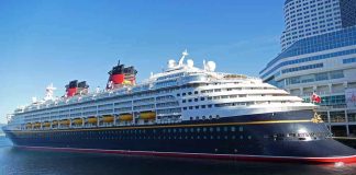 Cruise ship docked at a modern harbor terminal