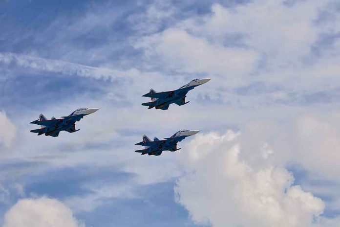 Three fighter jets flying in formation against a cloudy sky