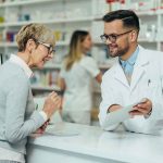 Ireland’s Three-Day LIFELINE AXED Pharmacist assists customer at pharmacy counter