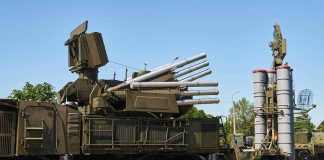 military air defense vehicles on a road