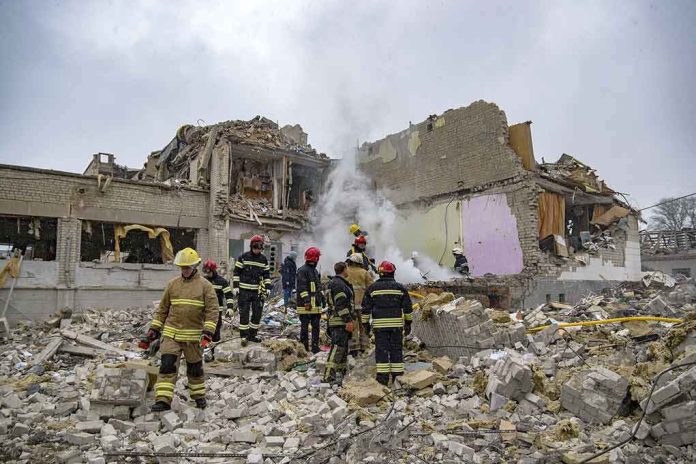 shutterstock_2132623665-1 Firefighters search rubble of a partially collapsed building