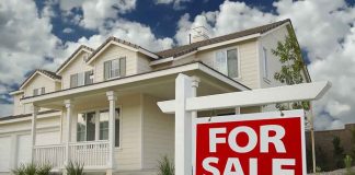 STATE Takeover Threat RATTLES HOME OWNERS A suburban house with a For Sale sign in the front yard