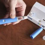 Smuggled FAKE Ozempic Hit U.S. Drug Suppliers — The Sellers KNEW It Hands taking the cap off a blue injection pen, with its package on the table