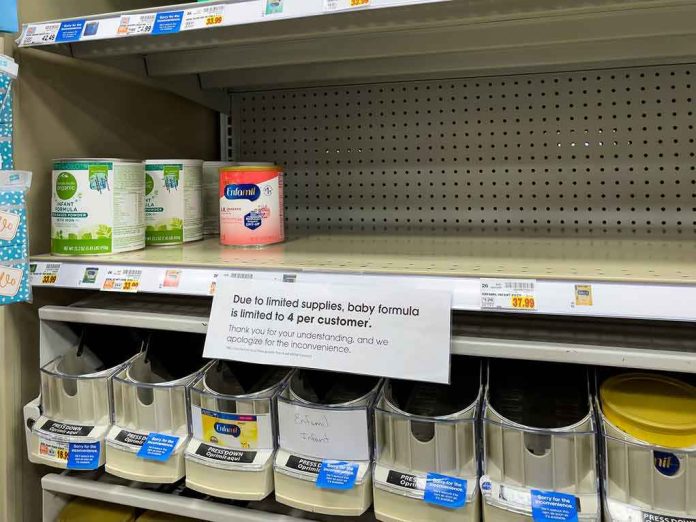 shutterstock_2155491293 Store shelf with mostly empty baby formula section and limit notice