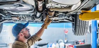 RECALL: One Rusted Bolt And The Steering Dies. Is Yours On The LIST? Mechanic inspecting underside of a car on a lift