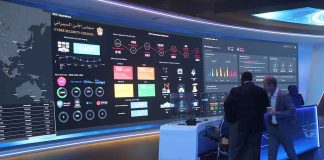 Pentagon Breach Took A TWIST — YOUR Family May Be In The Files cybersecurity operations room with large data dashboards and people discussing