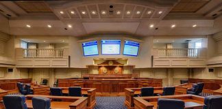 Courtroom interior with wooden benches and judge's bench
