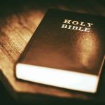 Holy Bible on a wooden table