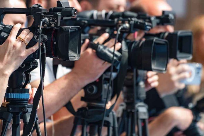 shutterstock_2692761619 television cameras on tripods at a media event