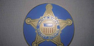 United States Secret Service badge emblem on blue background