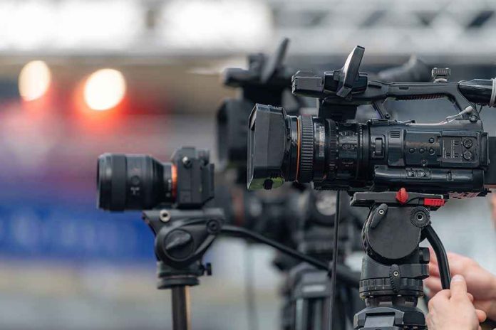 shutterstock_2762343045 Professional video cameras on tripods