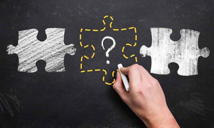 shutterstock_284969015 hand drawing puzzle piece with question mark on chalkboard