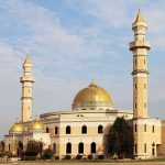 Teen Attackers Live-Streamed Mosque Nightmare Mosque with golden dome and two tall minarets under a partly cloudy sky