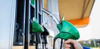 Diesel Declared A DISASTER — One Governor Tore Up The RULES Fuel pump nozzle held at a gas station