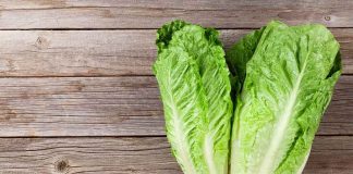 Romaine lettuce hearts on rustic wooden table