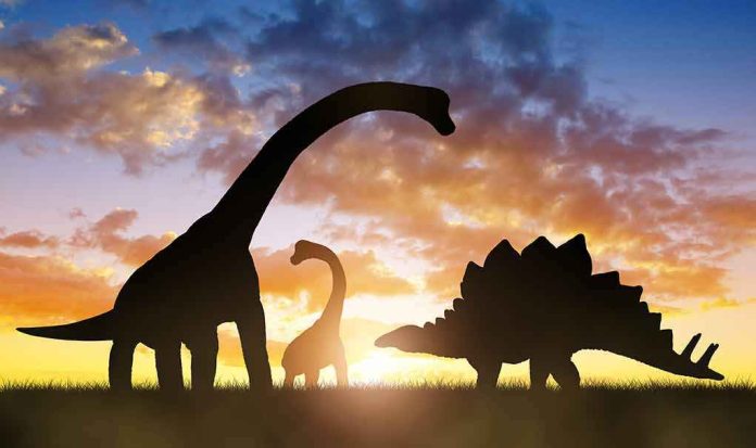 shutterstock_546813853-1 dinosaur silhouettes at sunset