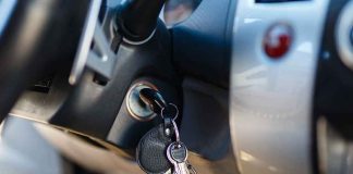 Car keys in ignition of a vehicle dashboard