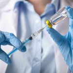It Bought 100 Extra Days — The Catch Is Who Took It Gloved hands drawing liquid from a vial with a syringe