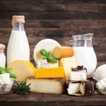 RECALL: Cheese Tied To Kidney Failure — Sold In Stores NATIONWIDE Assorted dairy products with milk and cheeses on a wooden table