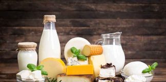 RECALL: Cheese Tied To Kidney Failure — Sold In Stores NATIONWIDE Assorted dairy products with milk and cheeses on a wooden table