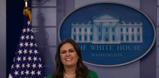 woman speaking at a White House press briefing podium