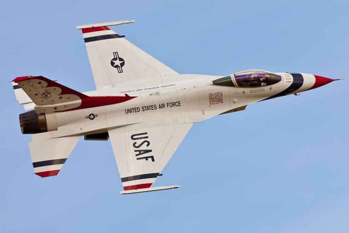 shutterstock_92964169 USAF fighter jet in flight against clear sky
