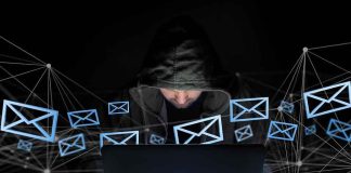 Family Fled Their Home TWICE Over Threats — Look WHO’s Accused Hooded person using a laptop surrounded by email icons