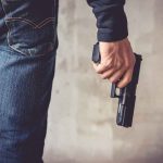 Cop SHOT Family’s Pet — His Excuse Doesn’t ADD UP person holding a handgun by their side