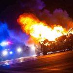 FIRE RISK Recall Hits 105,794 SUVs — Know The SIGN Burning car on a dark street at night