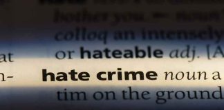 Jewish Man ATTACKED — What He Did The Very NEXT Day Close-up of dictionary page highlighting the term hate crime