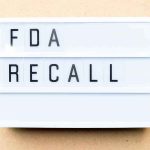 RECALL: Popular Sports Drink Pulled — Is YOURS On The LIST? Lightbox sign reading FDA recall on beige background