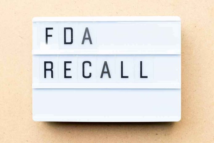 Lightbox sign reading FDA recall on beige background