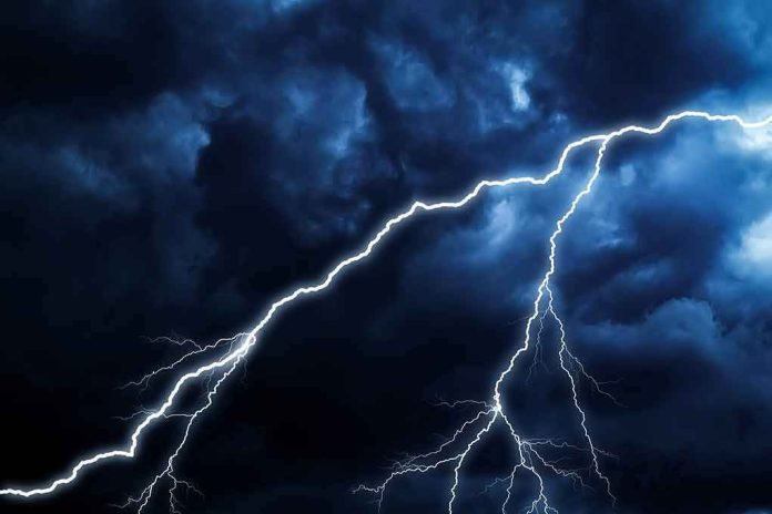Lightning bolts streak across dark storm clouds