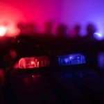 Police car light bar flashing red and blue at night