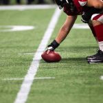 NFL Star’s UGLY Confession — His Past Is DISTURBING football player setting the ball on the line of scrimmage