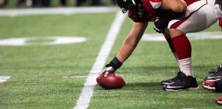 NFL Star’s UGLY Confession — His Past Is DISTURBING football player setting the ball on the line of scrimmage