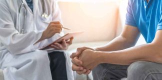 Silent Threat Hits Men HARDEST — Even Fit Men Aren’t SAFE Doctor consulting a patient on a sofa