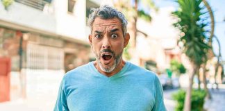 How Over 40,000 People Used The SAME Social Security Number! Man with surprised expression on a sunny street