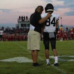 TOUGH Super Bowl Coach DIES — What He MEANT To Trump football coach with arm around player number 84 on sideline