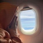 Jet’s EMBARRASSING Detour — And What The Pilot RADIOED Airplane passenger hiding face in hands beside the window