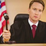 LYING Tech Giant Must PAY — The Jury’s MATH Is BRUTAL Judge holding a gavel in a courtroom