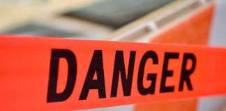 Giant Mill EXPLODED — The REAL DEADLY Danger Was Left Inside Danger tape at a construction barrier