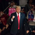 German Luxury BOSS Joins Trump — What He’ll Build HERE Donald Trump at a rally raising his fist amid a cheering crowd