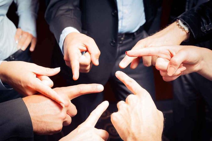 Group of hands pointing fingers at each other