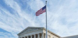 U.S. Supreme Court building with American flag